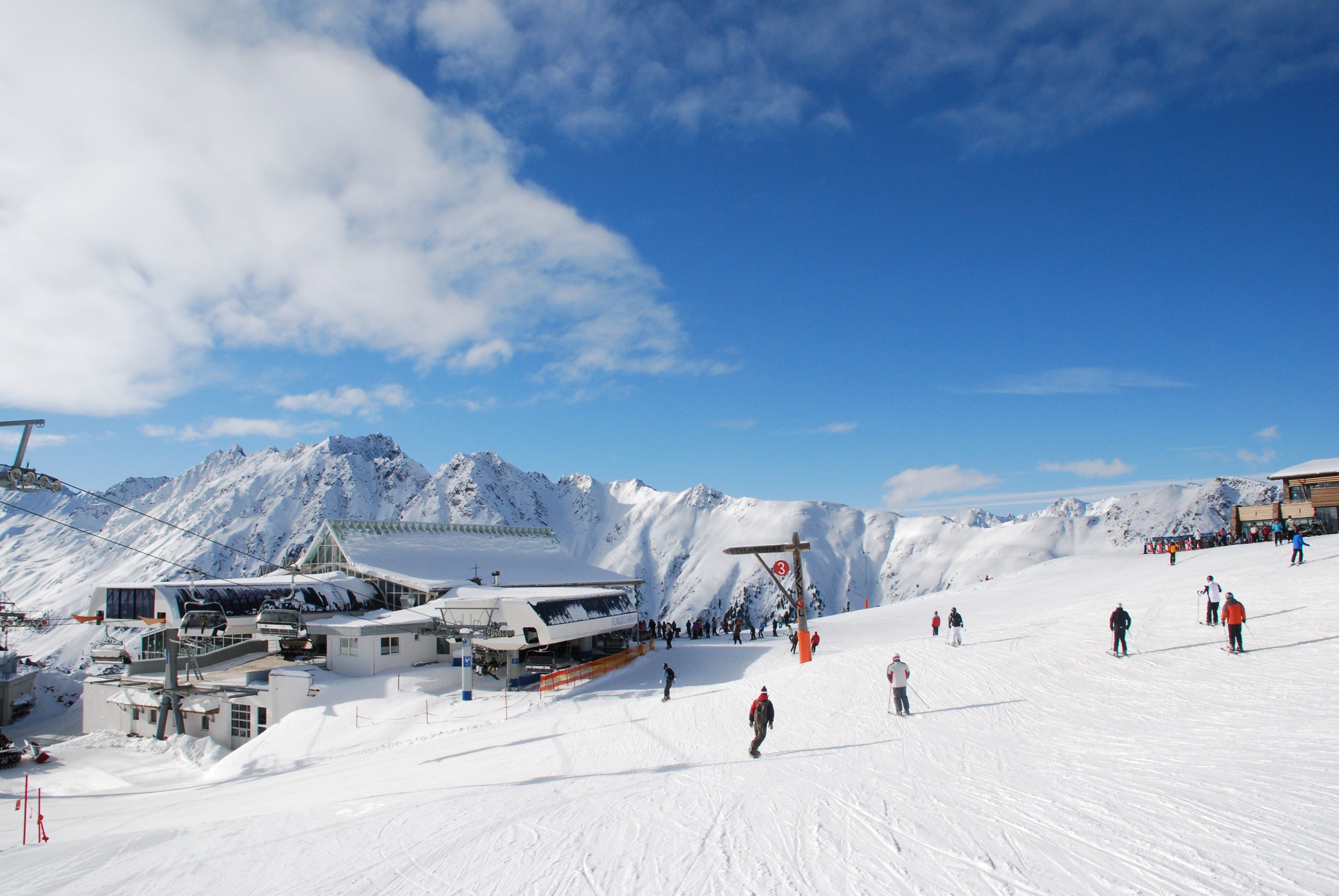 Ischgl, panorama view in swiss alps, skier in foreground